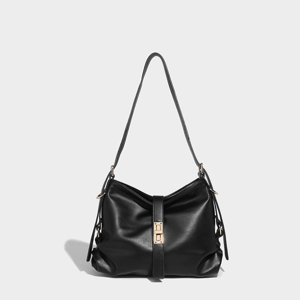 Soft slouchy hobo shoulder bag with smooth leather-look finish, gold-tone buckle and tab hardware, and long adjustable strap