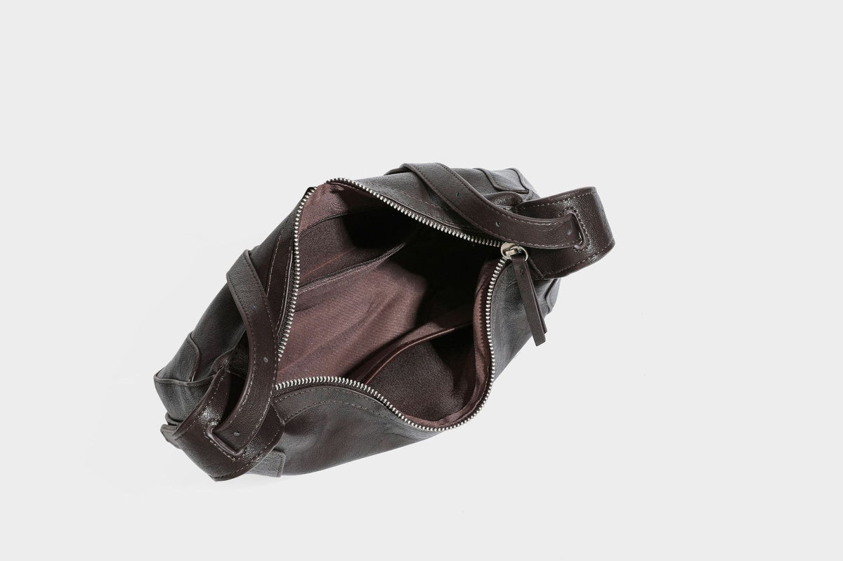 Slouchy crescent hobo shoulder bag in dark brown pebbled leather-look finish with zip top and long shoulder strap, detail