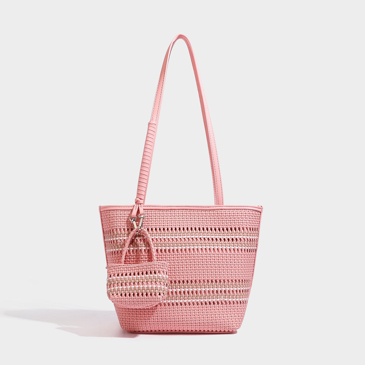 Large structured woven tote bag with striped basket-weave finish, long shoulder straps, and detachable mini pouch charm
