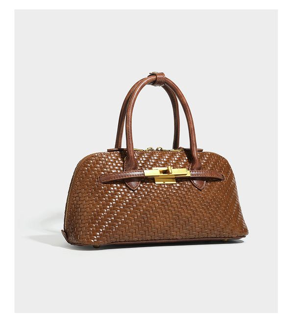 Structured woven-embossed leather-look satchel with dual rolled top handles, gold-tone turn-lock closure, and detachable