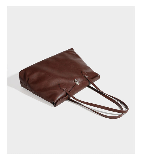 Large leather-look tote shoulder bag with slim double straps and silver-tone turn-lock closure, detail view 11