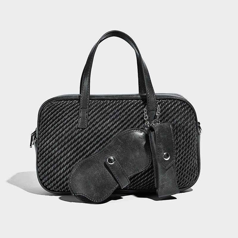 Structured woven-texture front top-handle handbag with zip closure, dual handles, detachable shoulder strap, and matching