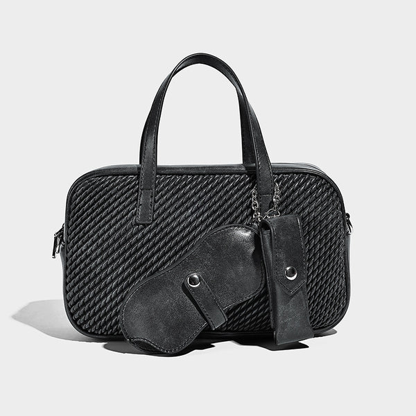 Structured woven-texture front top-handle handbag with zip closure, dual handles, detachable shoulder strap, and matching