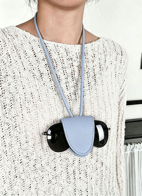 Woven bucket shoulder bag with leather-look trim, silver-tone hardware, and beaded tassel charm, detail view 17