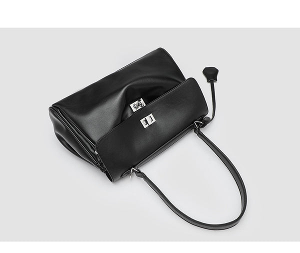 Structured black leather-look flap satchel bag with silver turn-lock hardware and top handle, detail view 13