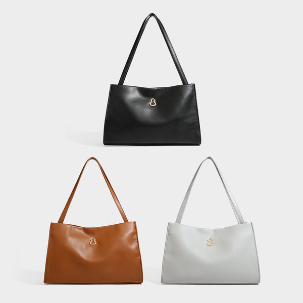 Structured rectangular shoulder tote bag with smooth leather-look finish, long double straps, and gold-tone gourd emblem on