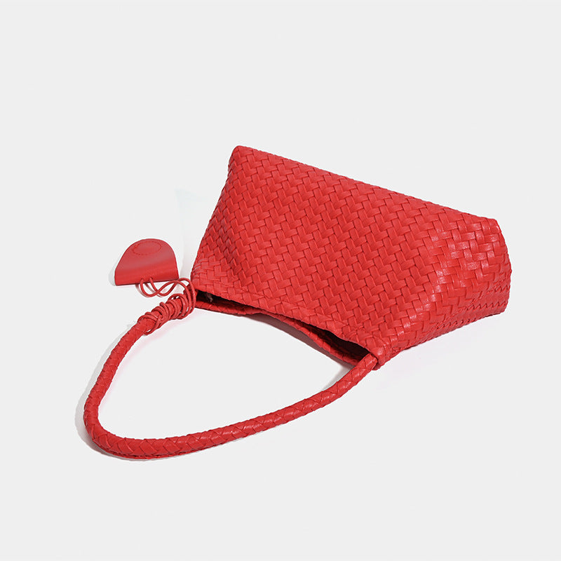 Woven leather-look shoulder bag with braided strap, trapezoidal body, and matching zip pouch, detail view 4
