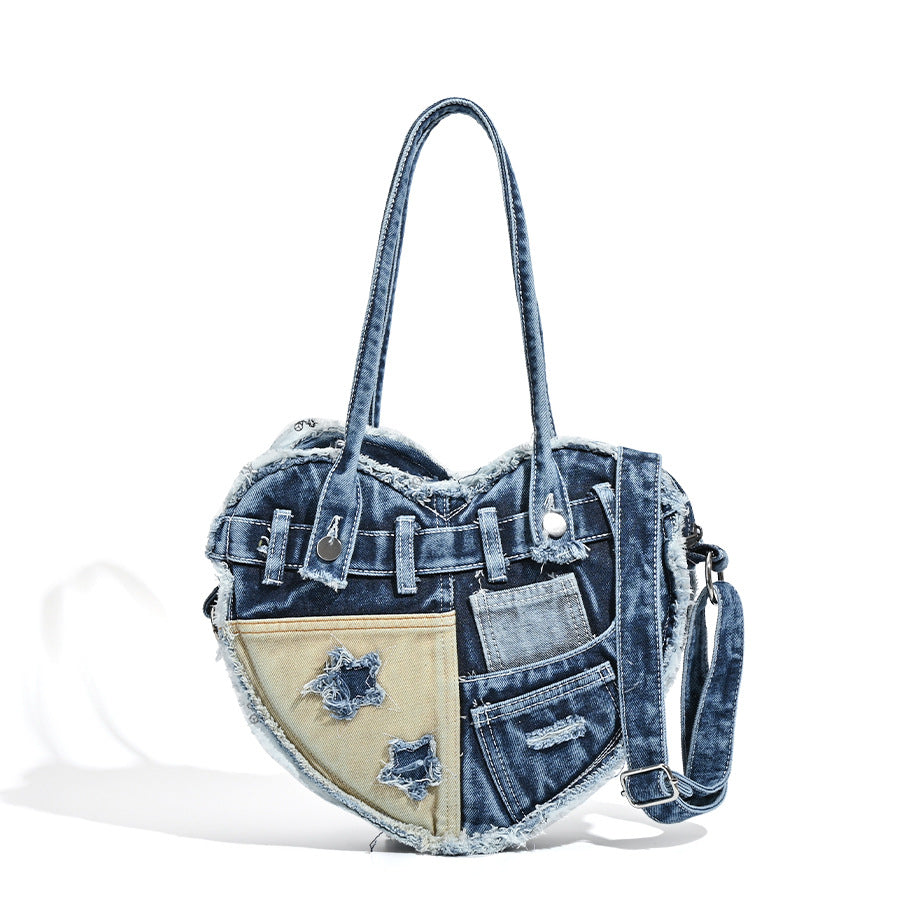 Heart-shaped patchwork washed denim shoulder bag with frayed edges, front patch pockets, and metal hardware, detail view 5
