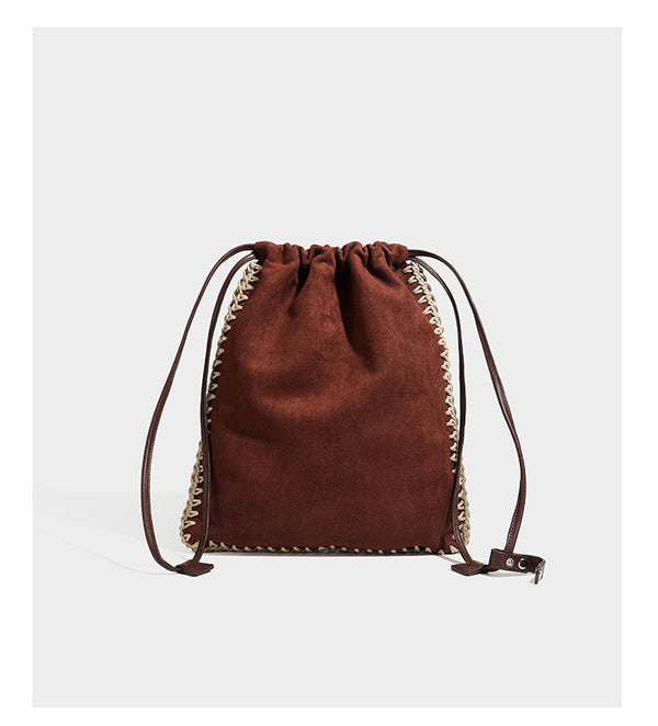 Matte suede-look drawstring bucket bag with cream braided woven edge trim and slim adjustable leather-look shoulder strap