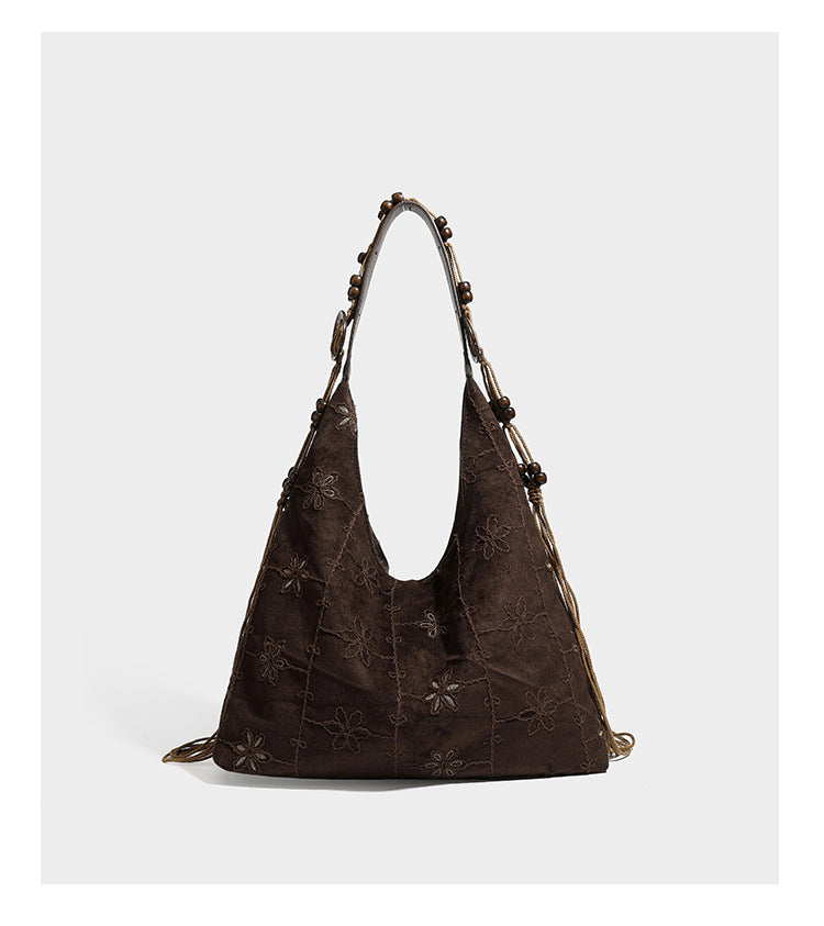 Dunkelbraune bestickte Hobo-Tote-Bag mit Schulterriemen in Lederoptik und Perlen, geknoteten Quastenbändern und ovalen Ringbeschlägen