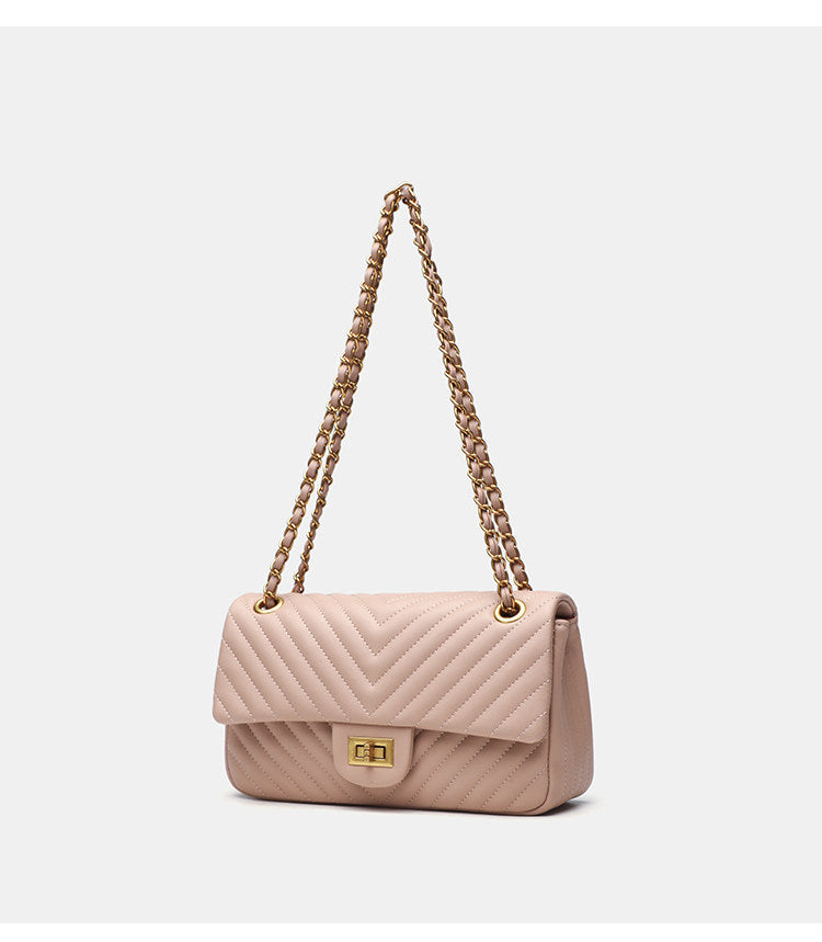 Structured quilted flap bag with gold-tone chain strap and turn-lock closure, detail view 9