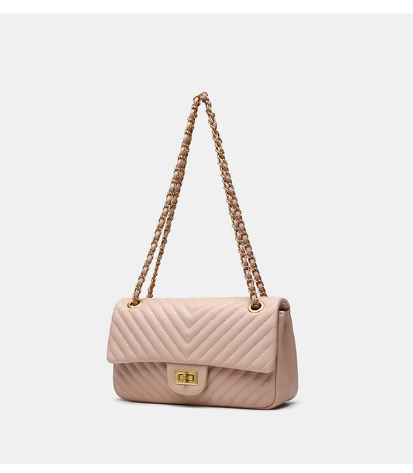 Structured quilted flap bag with gold-tone chain strap and turn-lock closure, detail view 9