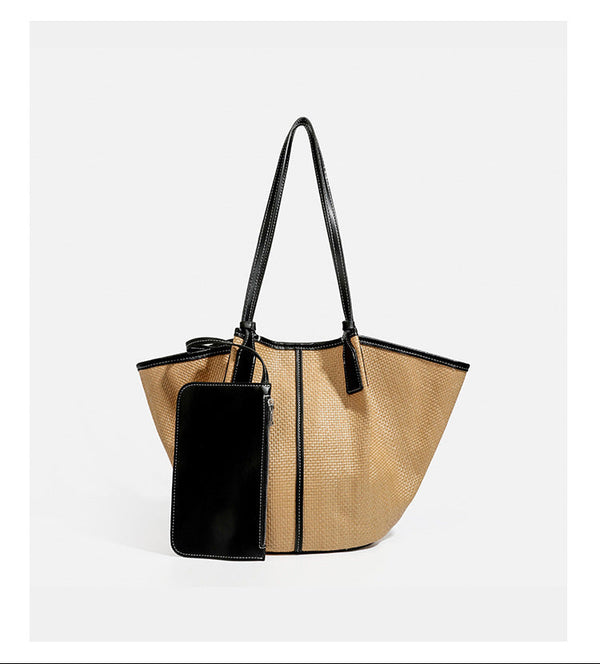 Tan woven tote bag with contrasting leather-look trim, long shoulder straps, and detachable rectangular zip pouch, detail