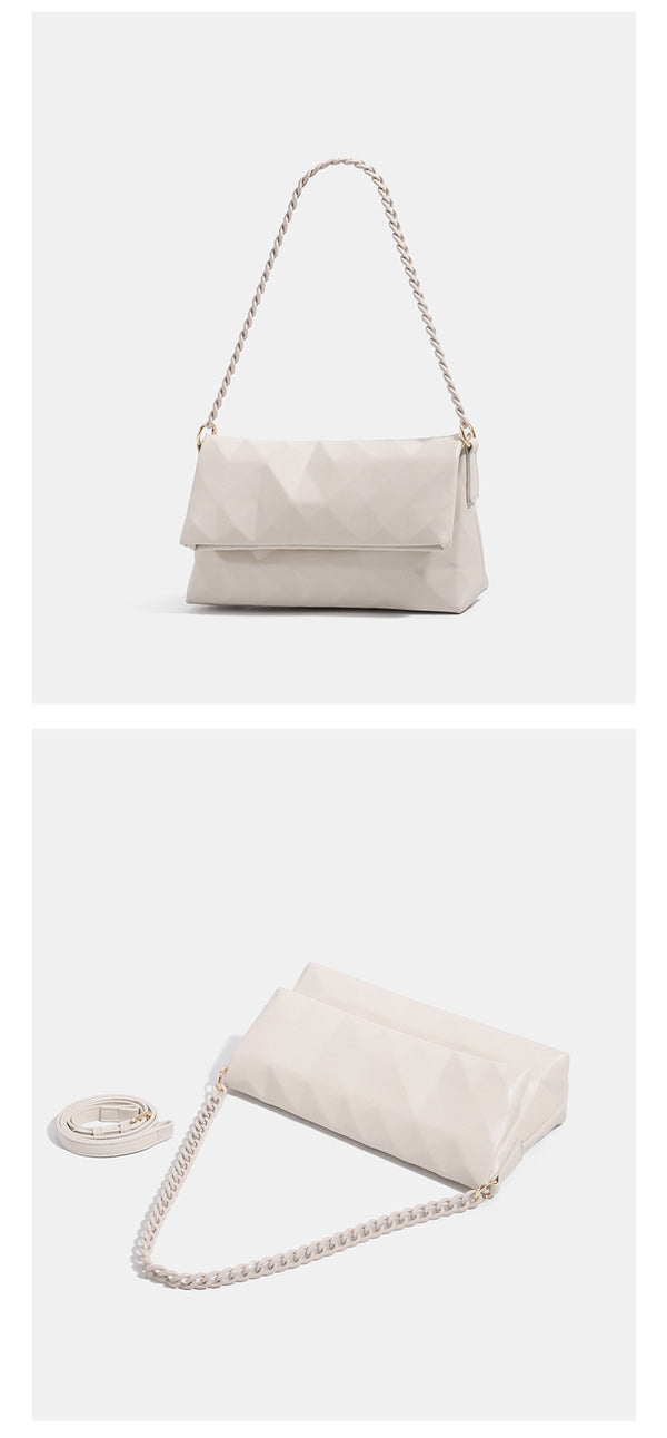 Geometric faceted flap shoulder bag with braided chain strap in black and ivory leather-look finish, detail view 10