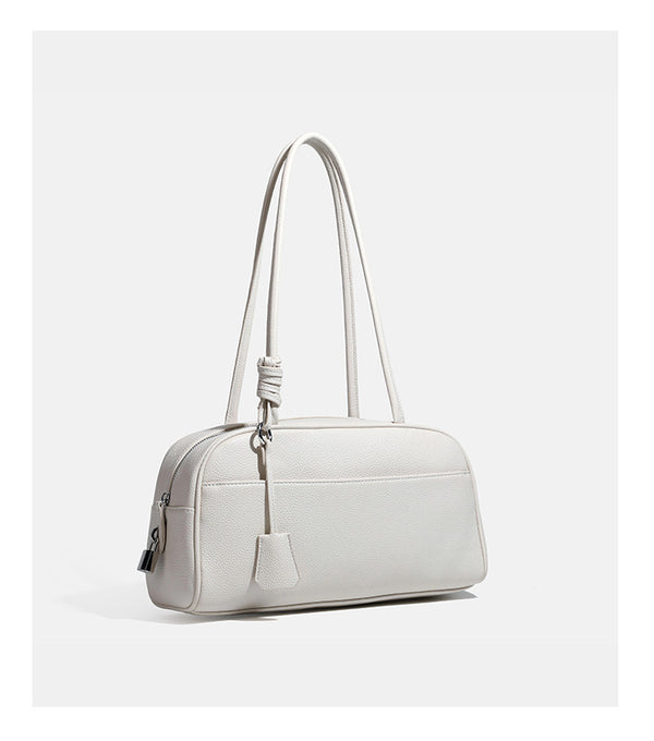 Structured rounded rectangular shoulder bag with pebbled leather-look finish, dual long handles, top zipper, front zip