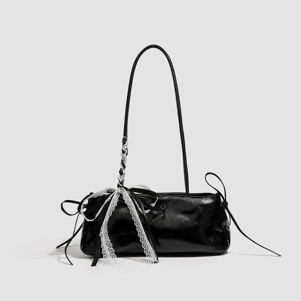 Compact glossy leather-look shoulder bag with lace bow and ribbon trim, front view
