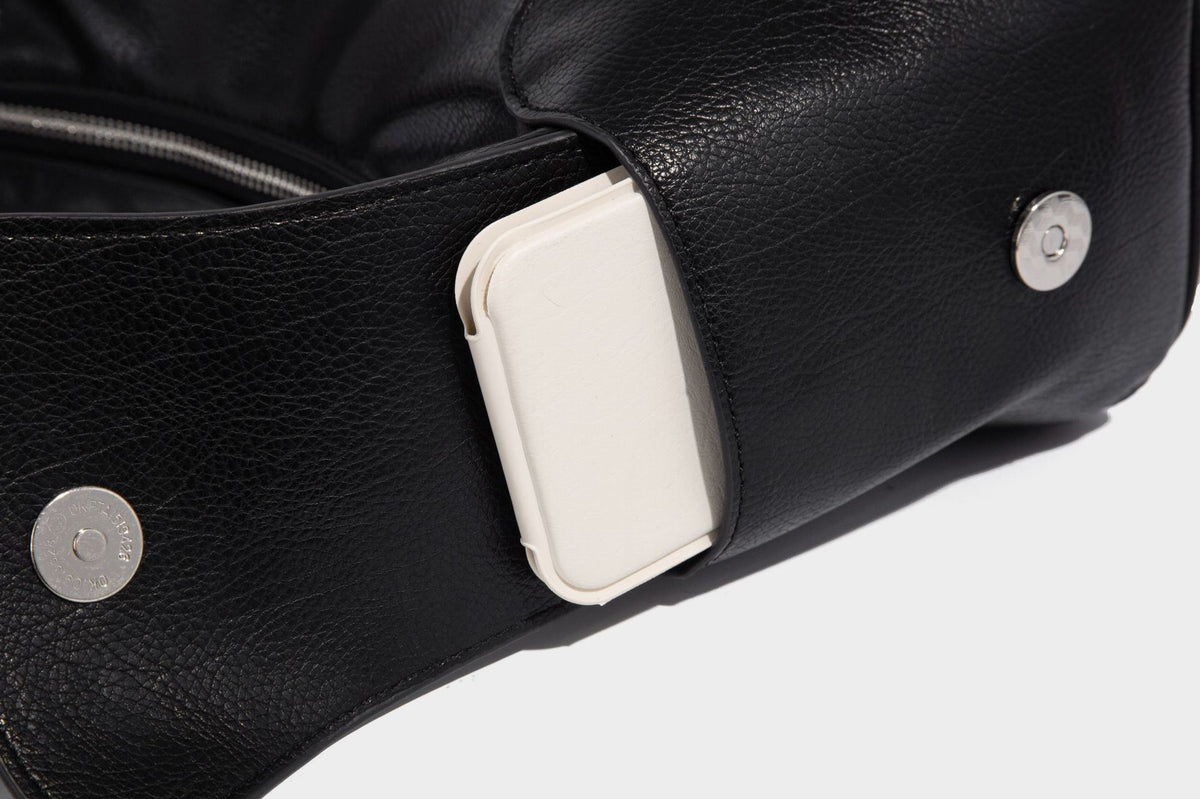 Soft pebbled leather-look hobo shoulder bag with zip top closure, side flap pockets, and silver-tone hardware, detail view 23