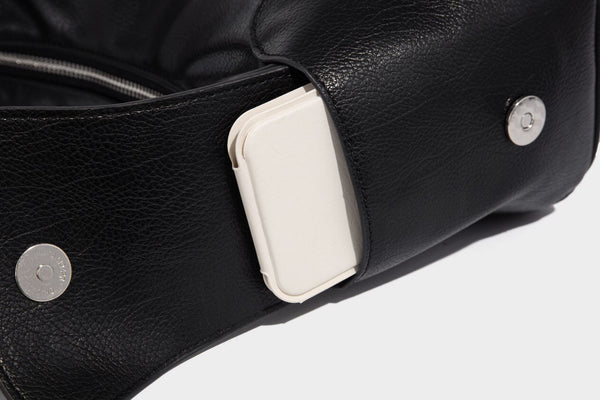 Soft pebbled leather-look hobo shoulder bag with zip top closure, side flap pockets, and silver-tone hardware, detail view 23