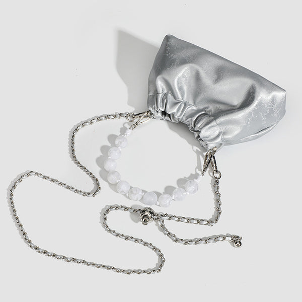 Small ruched drawstring pouch bag with pearl-bead handle and silver-tone chain strap, detail view 4