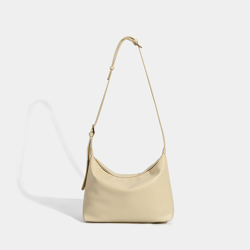Soft slouchy zip shoulder crossbody bag with smooth matte leather-look finish and gold-tone hardware, front view