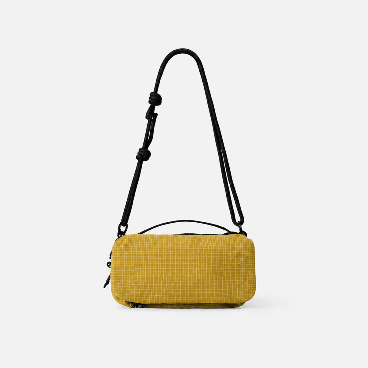 Compact rectangular zip-top nylon crossbody bag with knotted adjustable strap and short top handle, front view