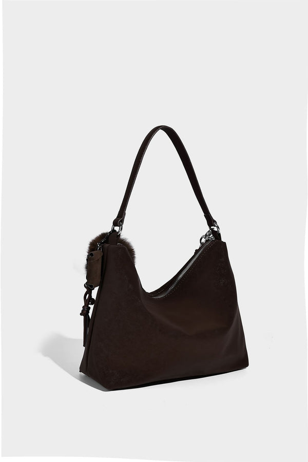 Slouchy matte-finish hobo shoulder bag with tassel cords, silver-tone hardware, and faux-fur pom charm, detail view 23