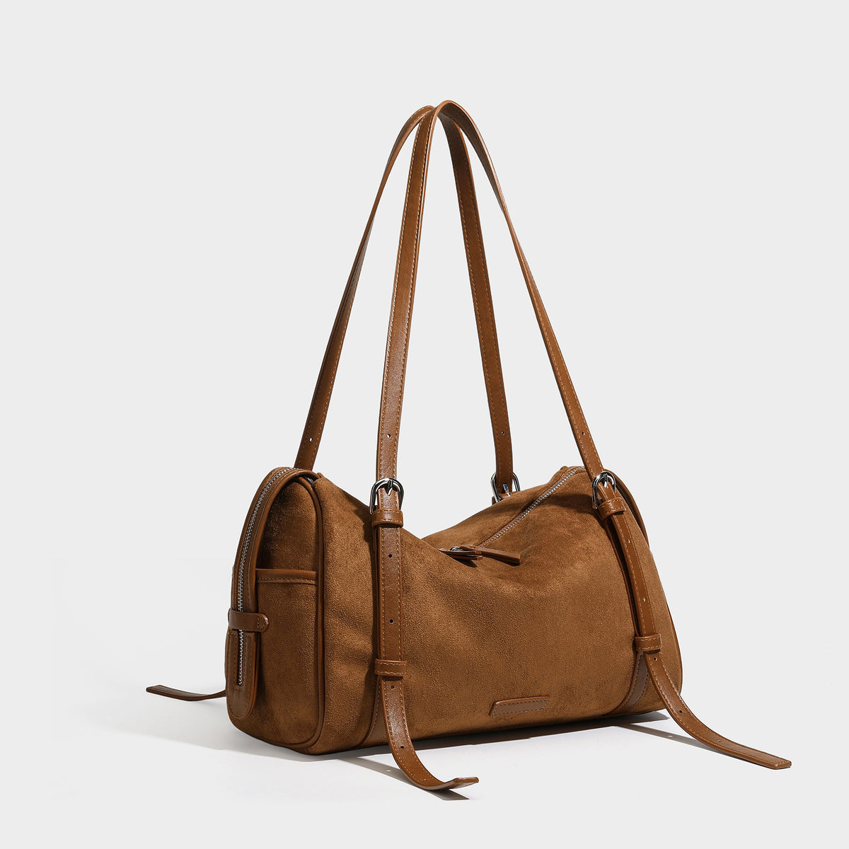 Large brown suede-finish barrel shoulder bag with dark leather-look trim, silver-tone zippers, dual top handles, and long