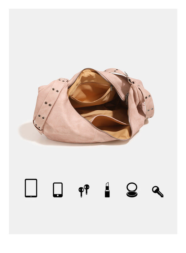 Crescent hobo shoulder bag in matte leather-look finish with star stud front panel, antique-silver hook hardware, and, detail