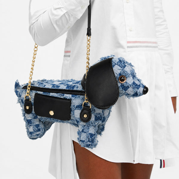 Dachshund-shaped frayed denim patchwork crossbody bag with black leather-look ear, gold-tone chain strap, and front, front
