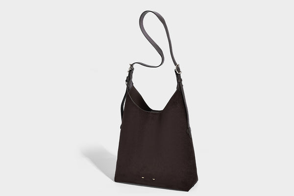 Large open-top hobo shoulder bag in tan leather-look finish with detachable zip pouch and adjustable buckle strap, detail
