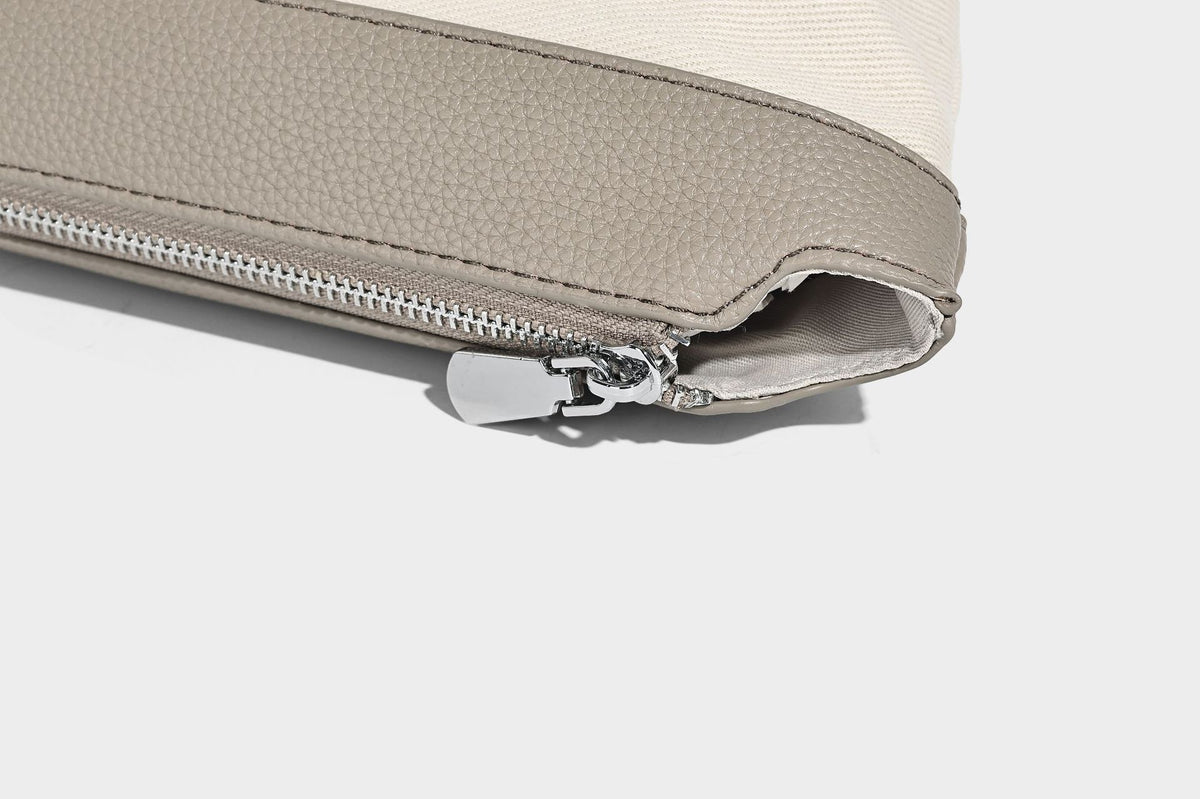 Soft slouchy hobo shoulder bag in pebbled matte finish with slim strap, silver-tone ring hardware, and knotted printed scarf