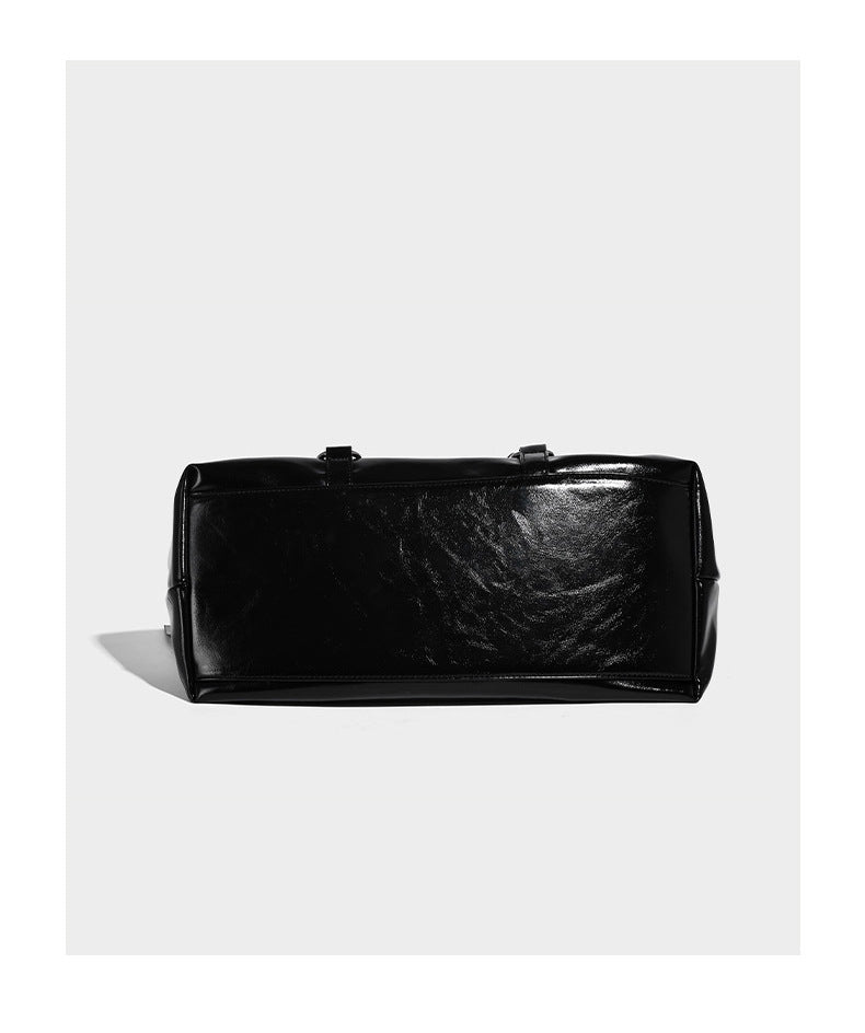 Glossy patent-look slouchy tote bag with ruched drawstring sides, dual top handles, silver ring hardware, and detachable