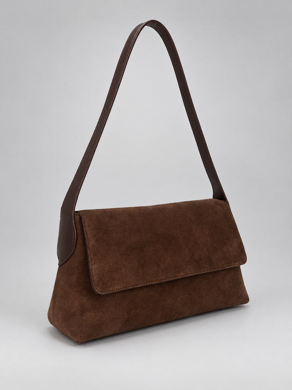 Rectangular matte suede-finish flap shoulder bag with slim dark strap and gold-tone turn-lock hardware, detail view 13