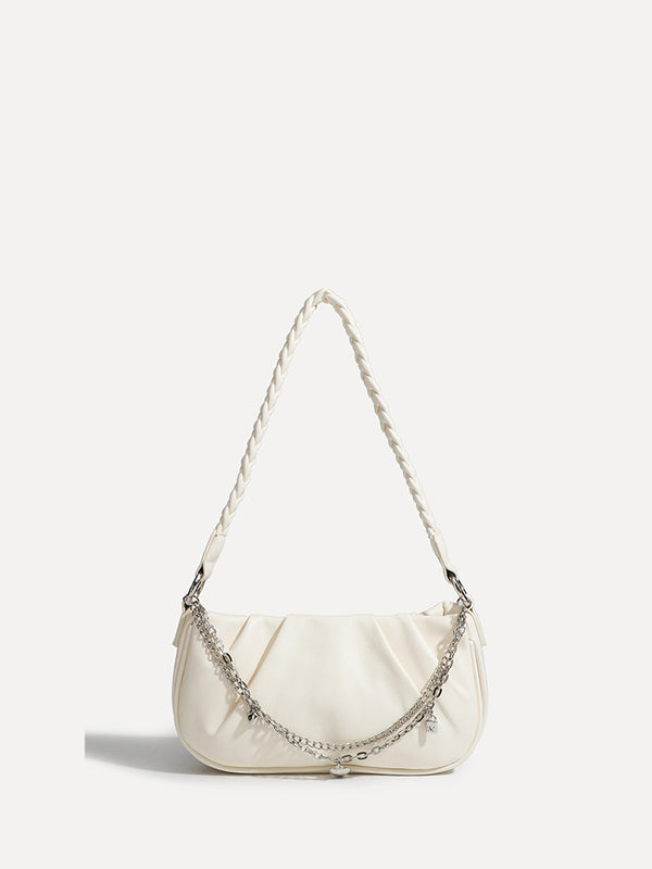Slouchy hobo shoulder bag with gathered leather-look panels, silver-tone chain with charm pendants, and braided strap, detail