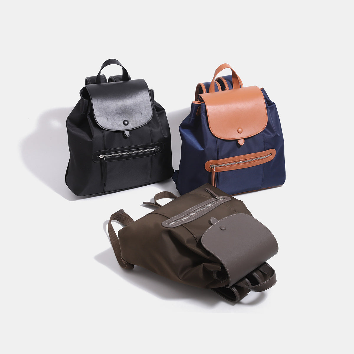 Structured flap backpack handbag with snap closure and front zip pocket, detail view 2