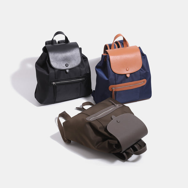 Structured flap backpack handbag with snap closure and front zip pocket, detail view 2