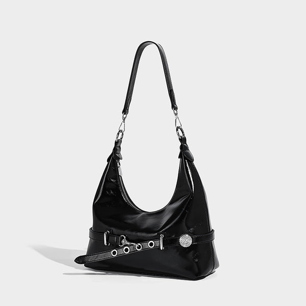 Glossy black slouchy hobo shoulder bag with silver-tone hardware, belt-style grommet strap at base, and long adjustable