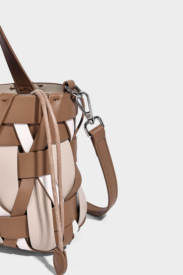 Small structured woven lattice tote bag with dual top handles and detachable shoulder strap in brown and cream leather-look