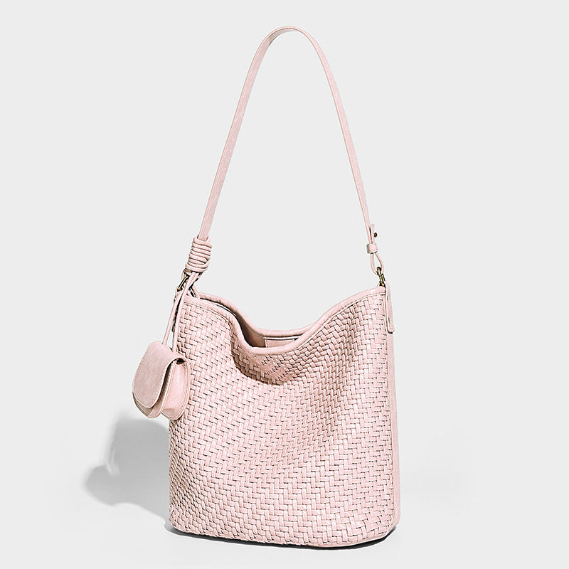 Slouchy woven bucket hobo shoulder bag in pink with detachable mini pouch and gold-tone hardware, front view