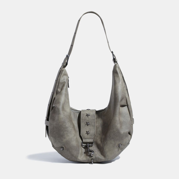 Crescent hobo shoulder bag in matte leather-look finish with star stud front panel, antique-silver hook hardware, and, detail