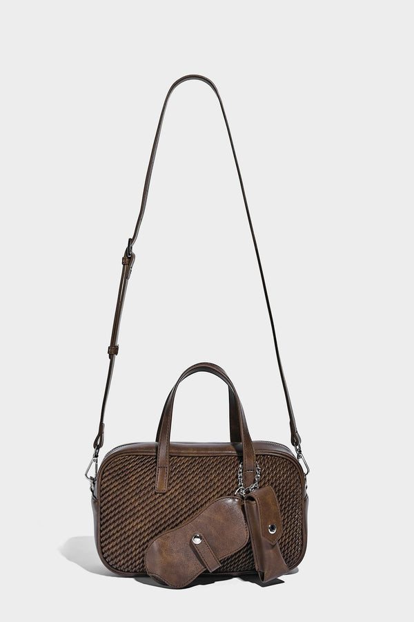 Structured woven-texture front top-handle handbag with zip closure, dual handles, detachable shoulder strap, and matching
