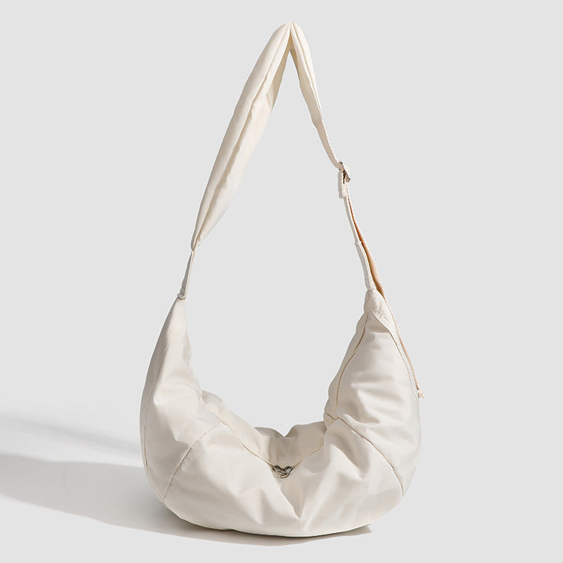 Large crescent sling shoulder bag in gathered fabric with zip closure and adjustable strap, detail view 7
