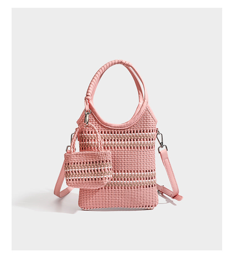 Color-block woven tote bag with rounded leather-look handles, detachable crossbody strap, and matching mini clip-on pouch in