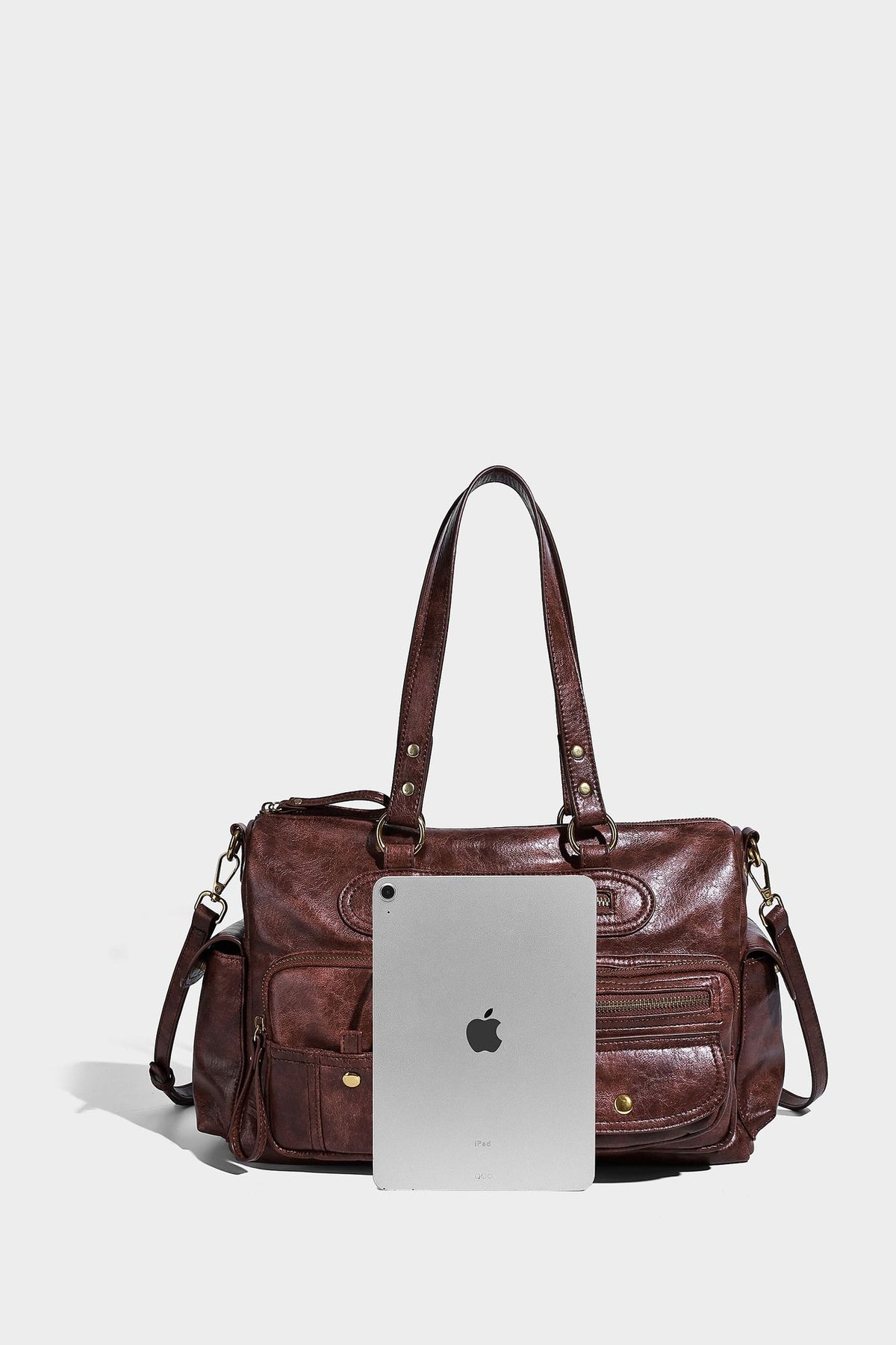 Distressed leather-look vintage satchel shoulder bag with multiple front zip pockets, dual top handles, and brass-tone