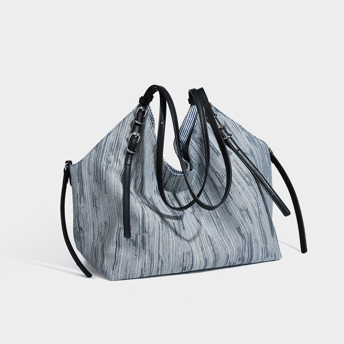 Large slouchy woven-texture shoulder tote bag with slim leather-look straps, side cinch ties, and silver-tone hardware