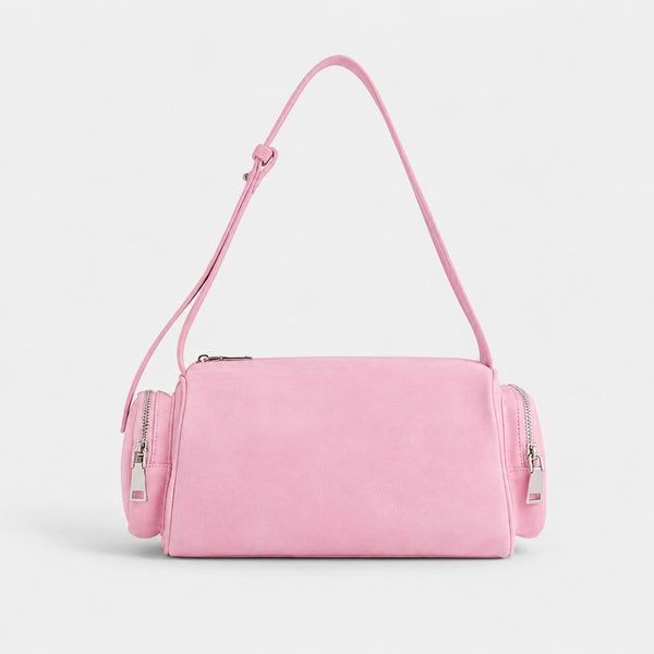 Mini barrel shoulder bag with side zip pouches and adjustable strap in pink suede-like finish, detail view 8