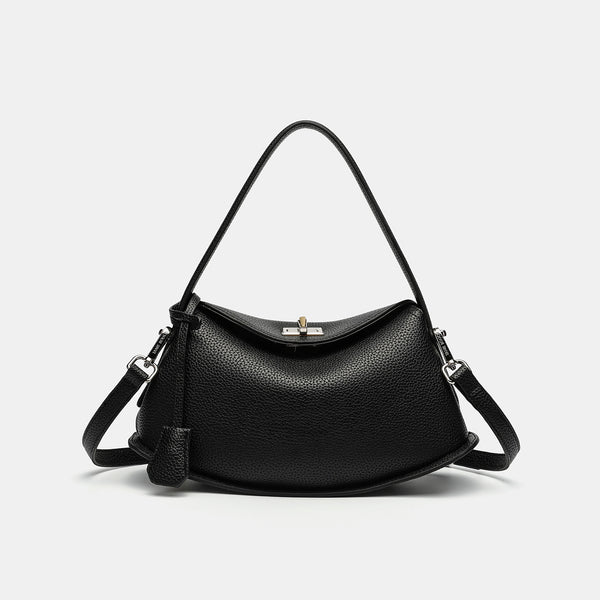 Pebbled leather-look half-moon saddle bag with turn-lock flap closure, top handle, and detachable crossbody strap, detail