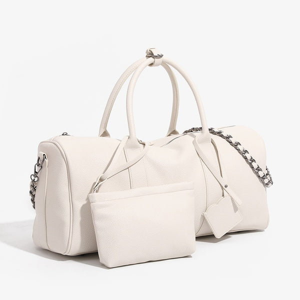Large cream white pebbled leather-look barrel travel bag with twin top handles, chunky chain shoulder strap, front zip