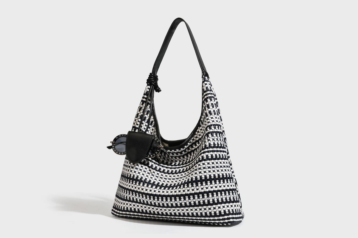 Slouchy woven stripe hobo shoulder bag with black-and-white pattern and leather-look strap, detail view 27