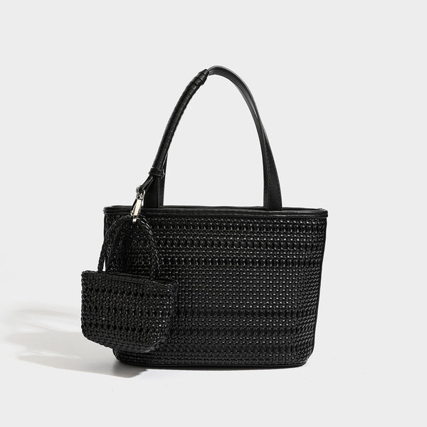 Structured open-weave tote bag with smooth leather-look trim, double top handles, detachable crossbody strap, and mini zip